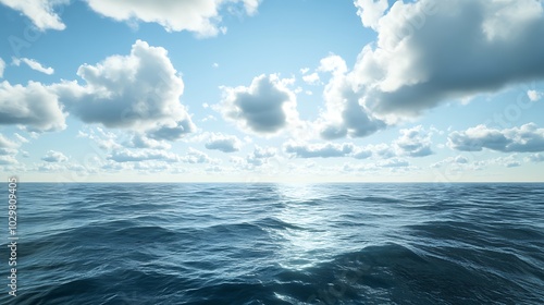 seascape with blue sky and clouds reflected in water.