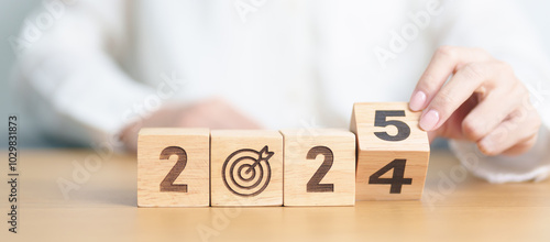 2024 year change to 2025 year block with dartboard icon. Goal, Target, Resolution, strategy, plan, Action, mission, motivation, and New Year start concepts