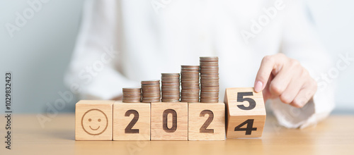 Wallpaper Mural 2024 end year to Happy New Year 2025 with Coins stack and Smile icon. goal, Money, Budget, investment, financial, savings, New Year Resolution, Satisfaction, feedback, Review and good year concept Torontodigital.ca