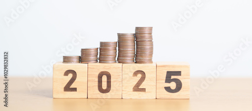 Wallpaper Mural Happy New Year 2025 with Coins stack. Money, Budget, tax, investment, financial, savings and New Year Resolution concepts Torontodigital.ca