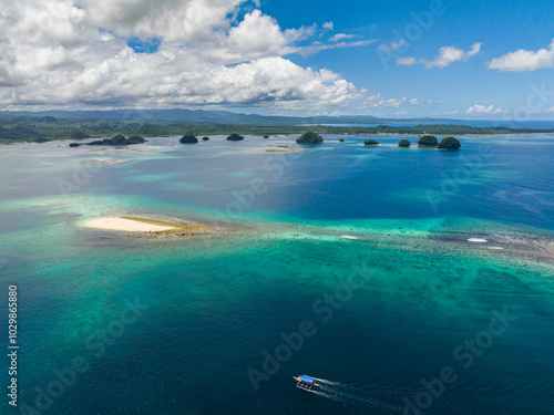 Small white island sandbar in the middle of the sea. Britania Group of Islands. Mindanao, Philippines.