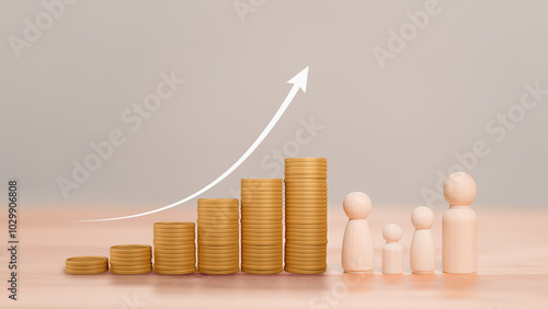 Photos Stacks of gold coins, symbolizing financial growth and wealth, with a arrow pointing upward