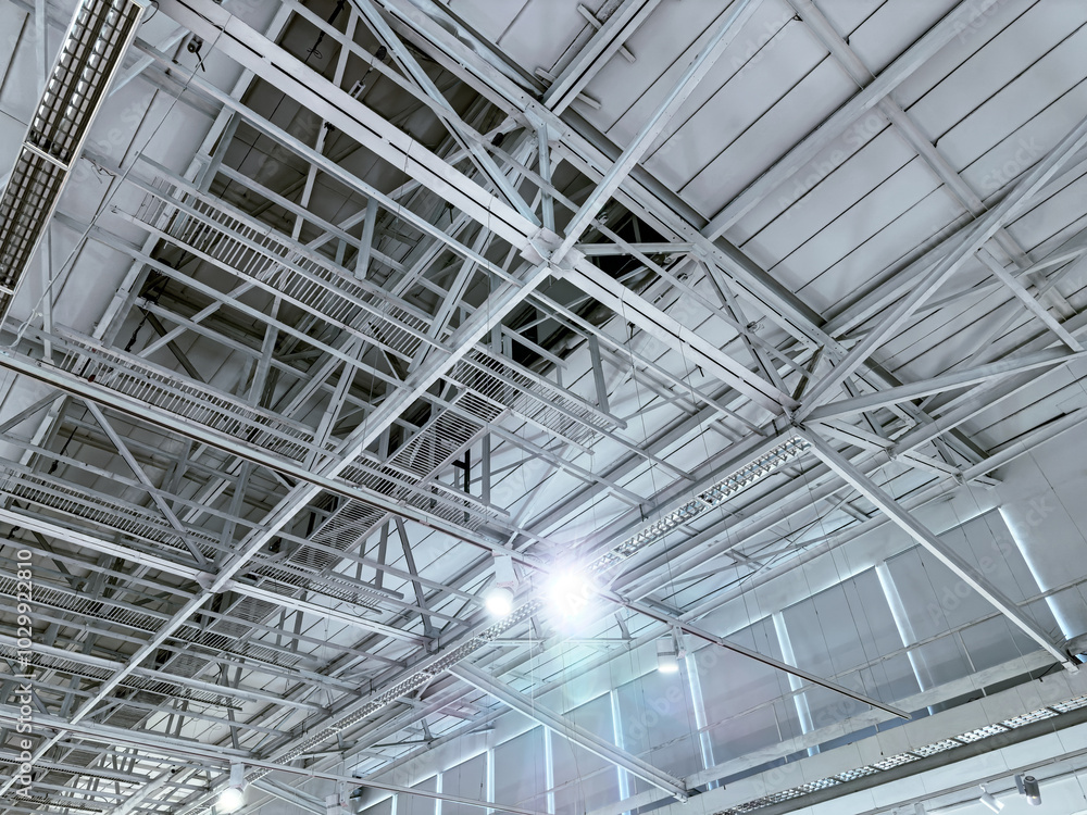 bottom view of industrial roofing with steel beams. roof of large modern storehouse. bottom view of industrial roofing with steel beams. roof of large modern storehouse.
