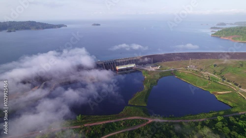 Drone view of water dam with reservoir, between the clouds, Afobaka dam Suriname photo