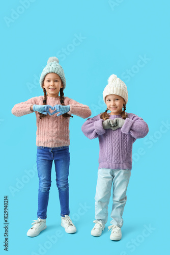 Cute little girls in warm c...