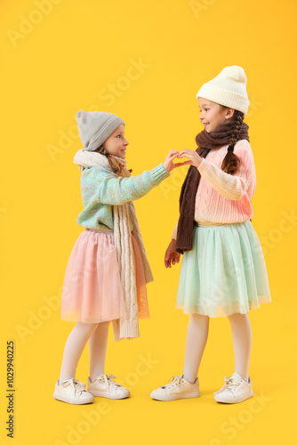 Cute little girls in warm c...