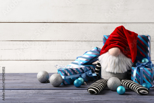 Christmas gnome with gift b...