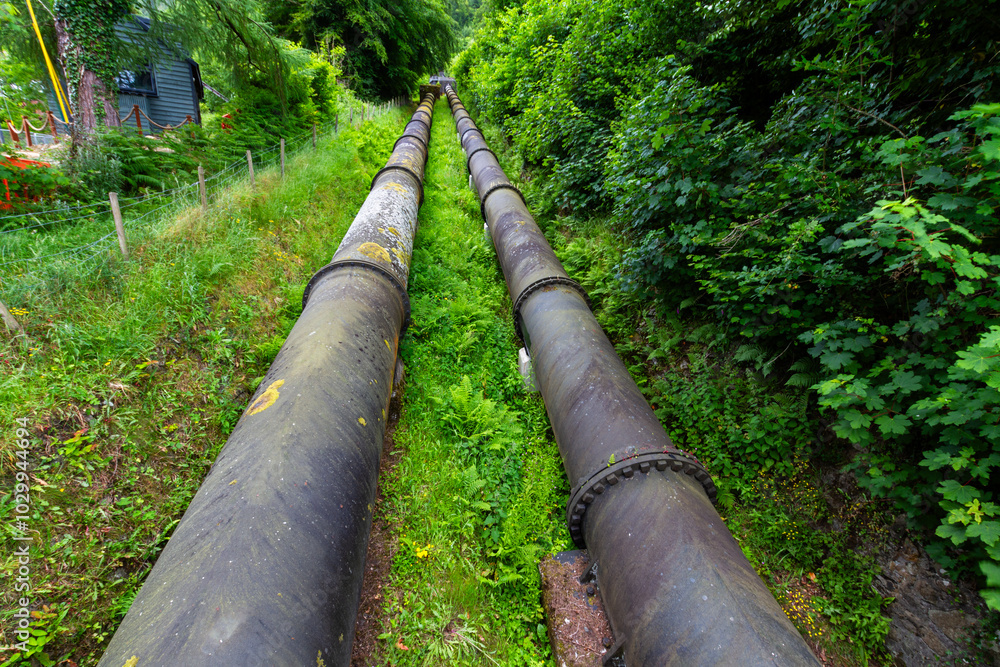 Two huge water pipes carrying water from the hills, landscape Two huge water pipes carrying water from the hills, landscape