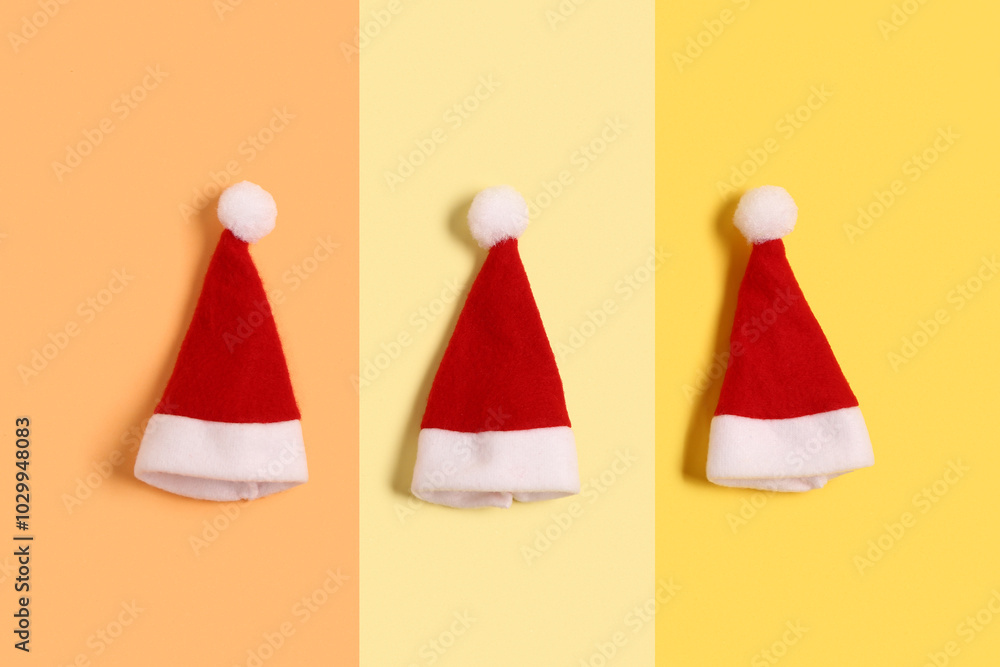 Santa Claus hats on colorful background Santa Claus hats on colorful background