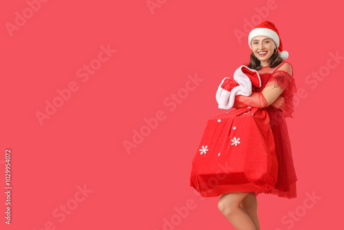 Happy young woman in Santa ...