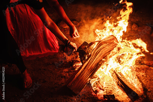 lighting a fire stick at a fair show.