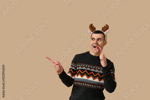 Young man in reindeer horns...