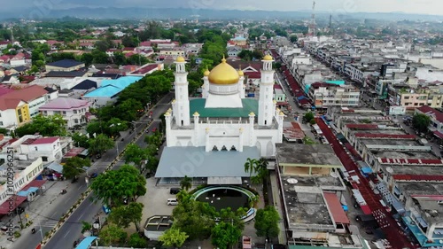 Aerial video across the golden roof of the grand mosque in Langsa City, Aceh photo