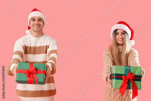 Happy young couple in Santa...