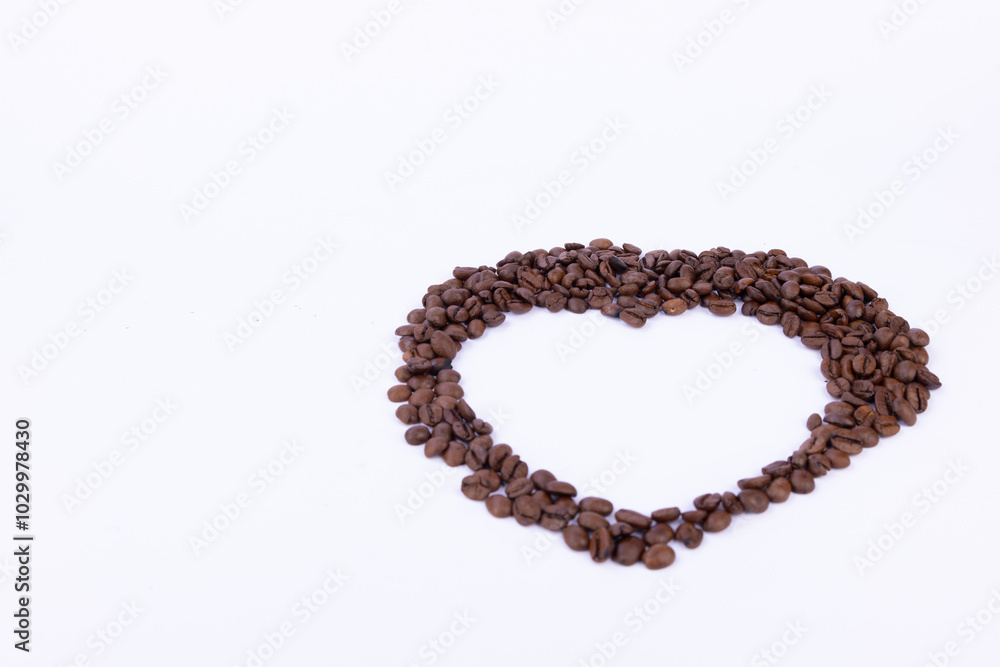 Heart Shape Made of Coffee Beans on White Background Heart Shape Made of Coffee Beans on White Background