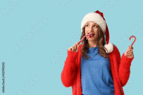 Young woman in santa hat an...