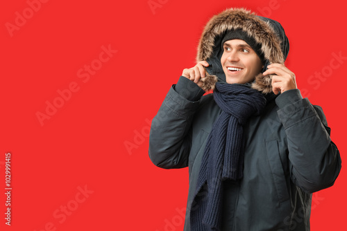 Young man in stylish puffer...