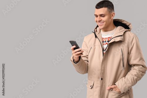 Young man in stylish puffer...