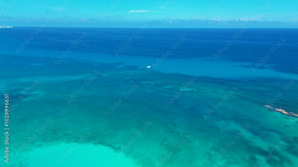 Drone aerial landscape of fishing trawler boat docked in reef sandbar ocean of Cancun Caribbean Sea Mexico snorkelling tours activities travel holidays tourism Drone aerial landscape of fishing trawler boat docked in reef sandbar ocean of Cancun Caribbean Sea Mexico snorkelling tours activities travel holidays tourism