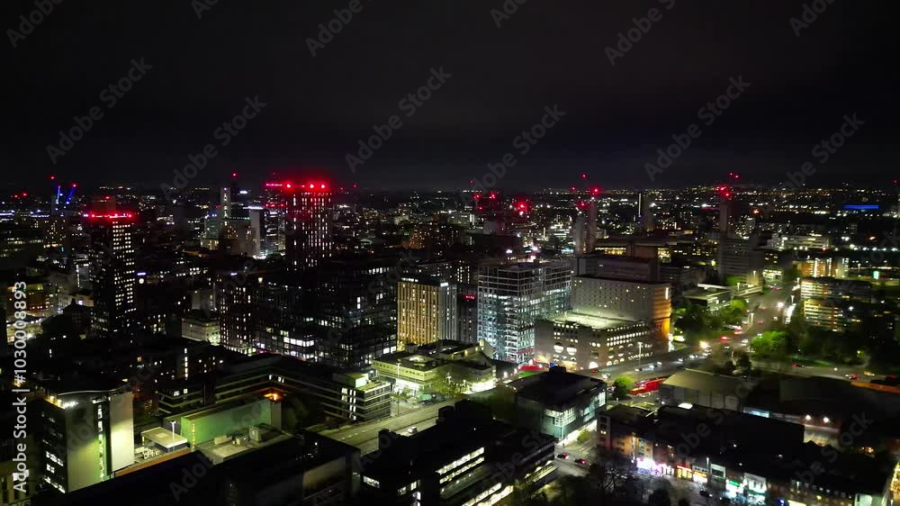 Aerial View of Illuminated Greater Manchester Central City During Cloudy Night, Northwest of England Great Britain. The High Angle Footage Was Captured During Midnight over Downtown of Manchester City Aerial View of Illuminated Greater Manchester Central City During Cloudy Night, Northwest of England Great Britain. The High Angle Footage Was Captured During Midnight over Downtown of Manchester City