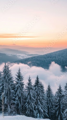 picturesque mountain landscape at dawn, featuring snow covered trees and serene atmosphere. soft hues of sunrise illuminate misty valleys, creating tranquil scene