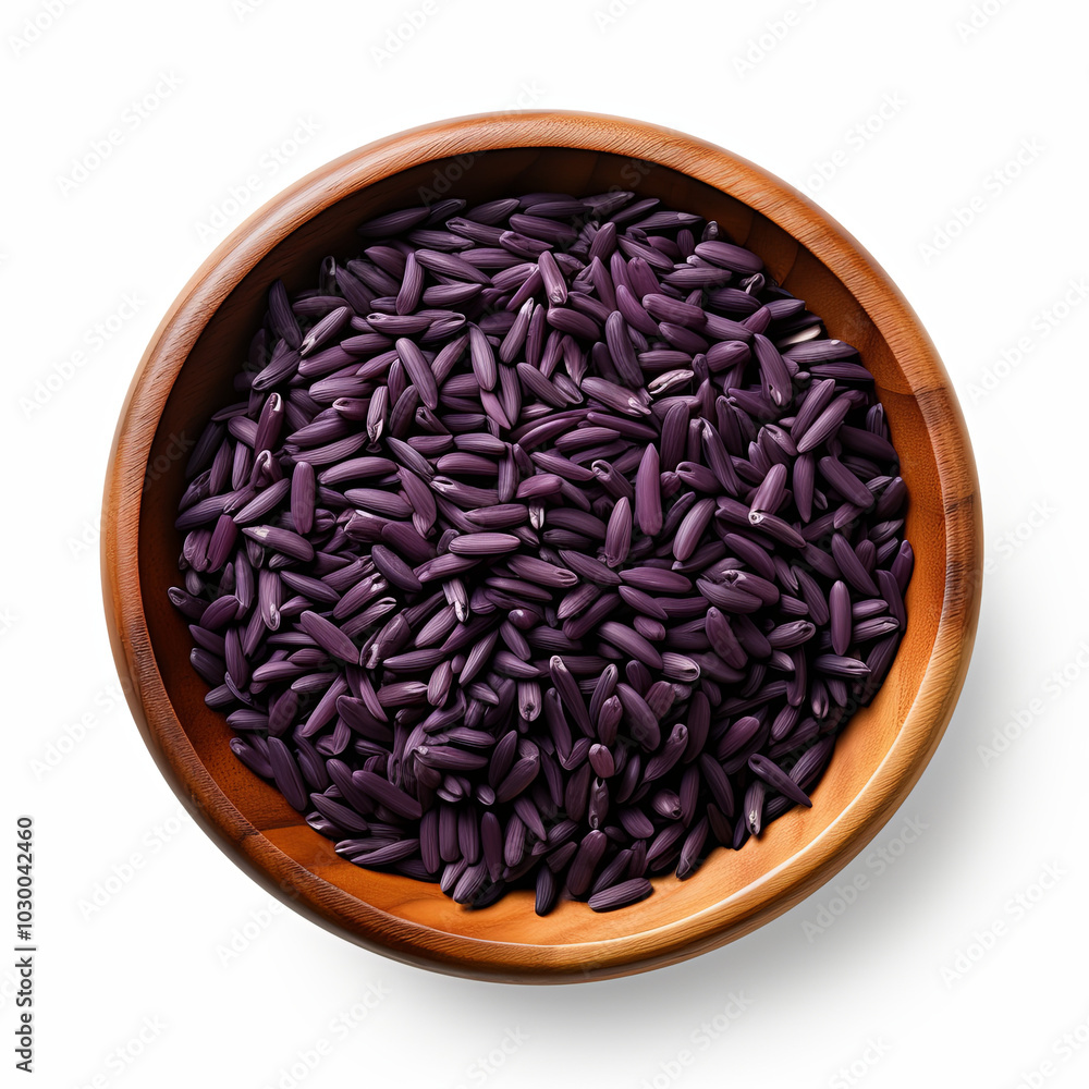 Dark purple riceberry is delicately arranged in a light brown round wooden cup. The top view reveals the beautifully arranged rice grains. Dark purple riceberry is delicately arranged in a light brown round wooden cup. The top view reveals the beautifully arranged rice grains.