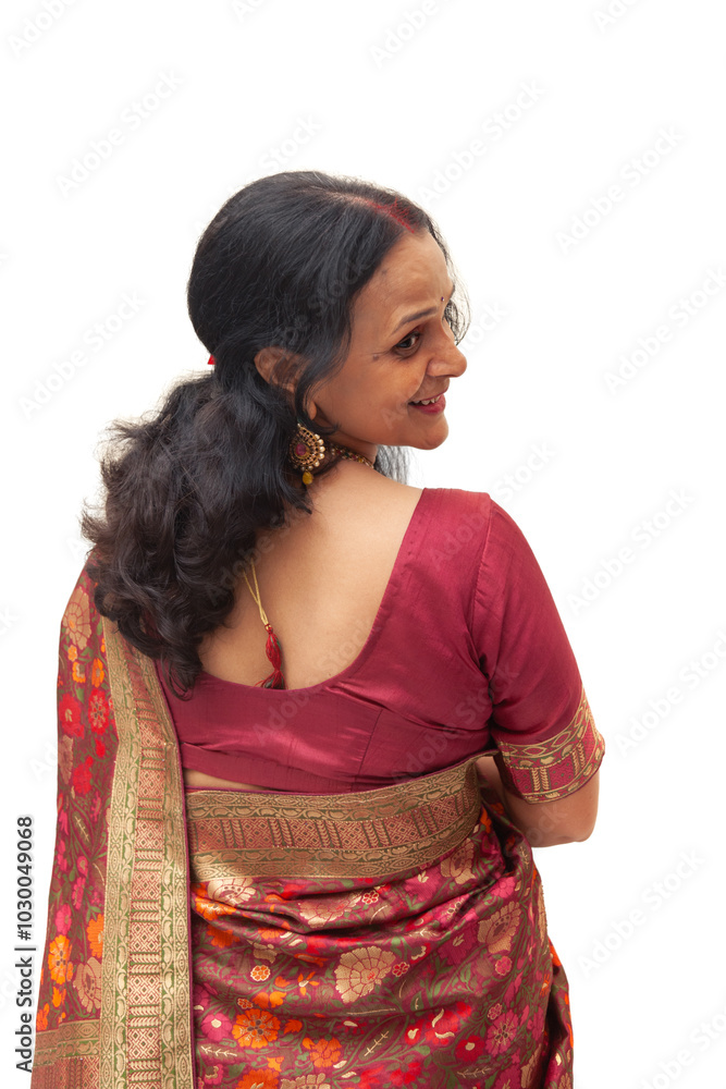 A joyful Indian woman from India is dressed in a beautiful traditional designer saree. A joyful Indian woman from India is dressed in a beautiful traditional designer saree.