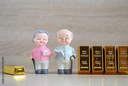 Mutual fund,Love couple senior and gold bar on wooder background, Save money for prepare in future and pension retirement concept photo