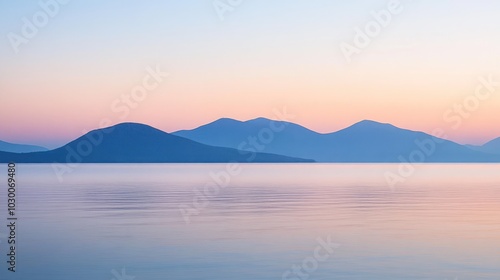 Wallpaper Mural Serene landscape with a soft pastel sky over calm water and a mountain range in the distance at sunrise. Torontodigital.ca