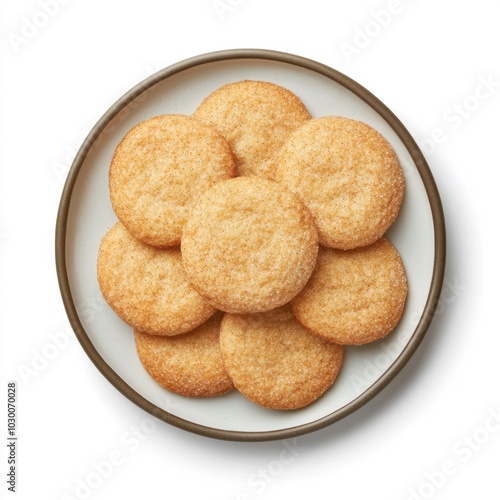 Freshly baked snickerdoodle cookies on white plate, overhead view