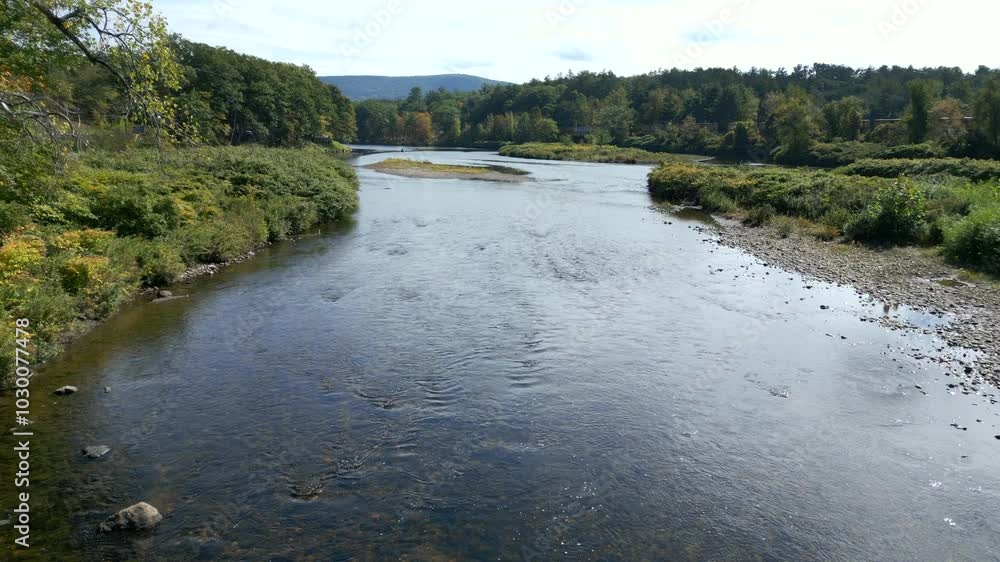Drone soars above water of Mohawk Trail by Deerfield River in Western Massachusetts New England USA Drone soars above water of Mohawk Trail by Deerfield River in Western Massachusetts New England USA