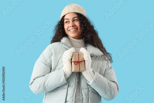 Happy young woman in winter...