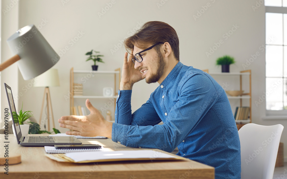 I dont understand. Confused man in glasses sitting at desk with laptop computer. Male user annoyed by error, slow network, lagging data. Angry hipster guy having argument while talking on video call I dont understand. Confused man in glasses sitting at desk with laptop computer. Male user annoyed by error, slow network, lagging data. Angry hipster guy having argument while talking on video call