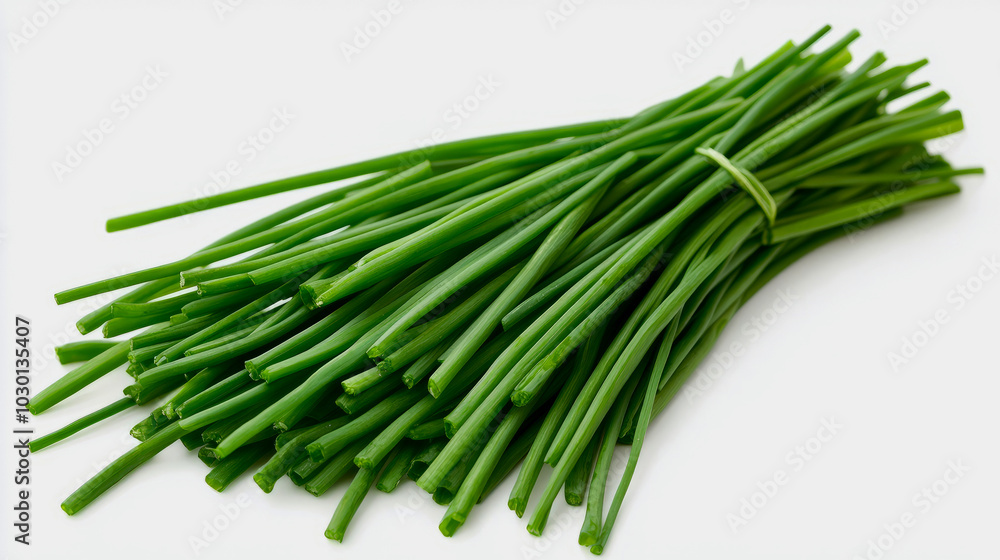 A close-up of fresh chives with their long, slender green stems, isolated on a white background A close-up of fresh chives with their long, slender green stems, isolated on a white background