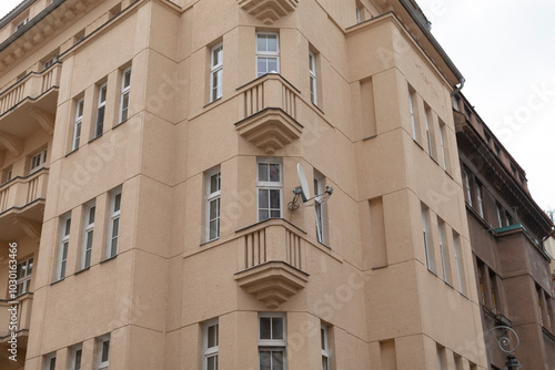 A large and impressive building featuring numerous windows and balconies that create a striking architectural appearance in the city skyline