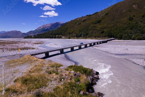 Car crossing Bealey Bridge over Waimakariri River, New Zealand photo