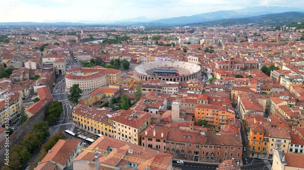 Aerial view of the city of Verona with its arena and mountain in the background, in Veneto, Italy Aerial view of the city of Verona with its arena and mountain in the background, in Veneto, Italy