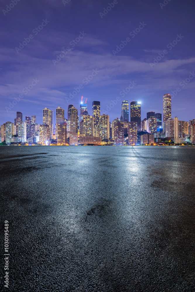 Asphalt road square and modern city buildings scenery at night. car background.