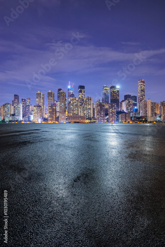 Obraz na płótnie Asphalt road square and modern city buildings scenery at night. car background. w salonie