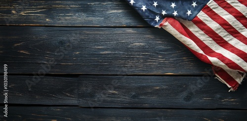 American flag draped on rustic wooden table background during a quiet moment ...
