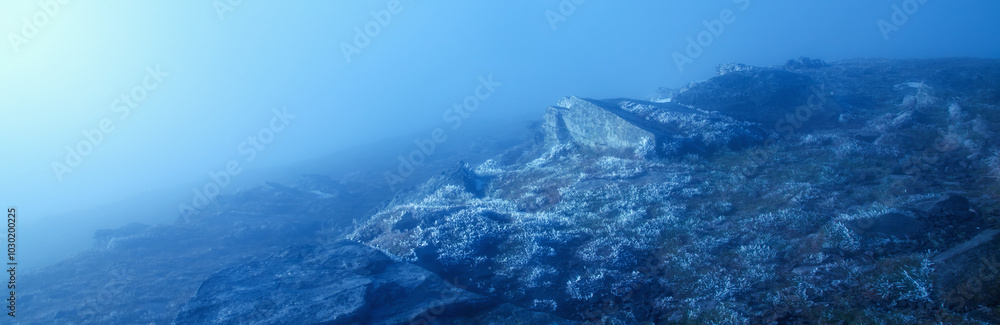 Fototapeta premium Landscape of mountain with clouds and nebula. Horizontal image.