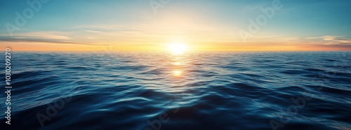 Golden sunset over calm ocean waves creates a serene atmosphere at twilight