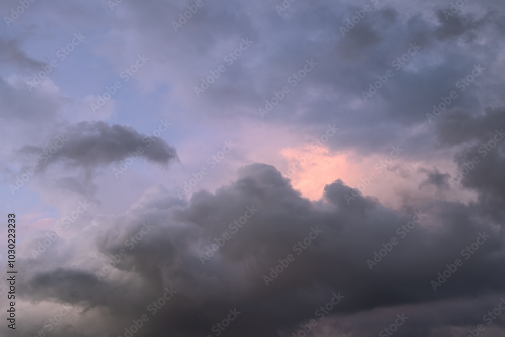 Overcast sky with dramatic cloud formations and a hint of pink from the setting sun, ideal for use as a background or sky replacement in projects needing a sunset ambiance Overcast sky with dramatic cloud formations and a hint of pink from the setting sun, ideal for use as a background or sky replacement in projects needing a sunset ambiance