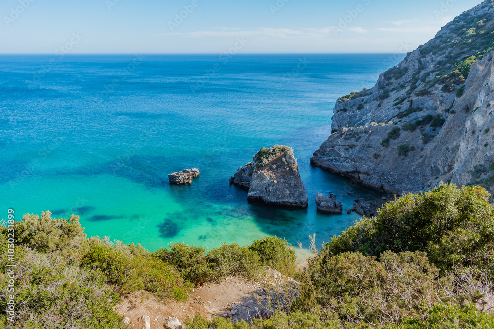 Trail in cliff with aerial view of paradisiac Ribeiro do Cavalo beach, Sesimbra PORTUGAL Trail in cliff with aerial view of paradisiac Ribeiro do Cavalo beach, Sesimbra PORTUGAL