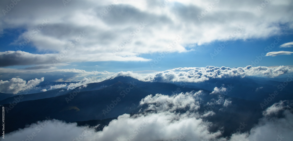 Between heaven and earth. Fog, clouds, nebula and clouds in the mountains. Horizontal image. Between heaven and earth. Fog, clouds, nebula and clouds in the mountains. Horizontal image.