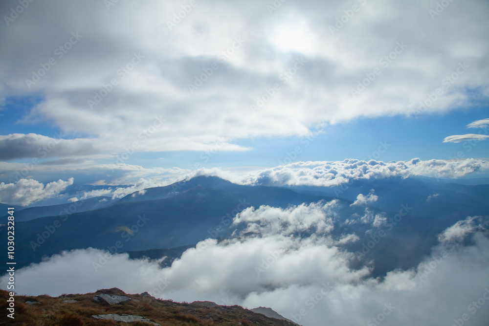 Between heaven and earth. Fog, clouds and nebula and clouds in the mountains. Horizontal image. Between heaven and earth. Fog, clouds and nebula and clouds in the mountains. Horizontal image.