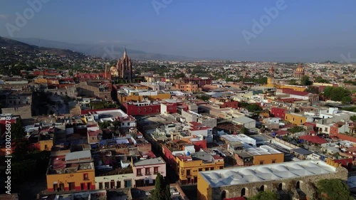 Wallpaper Mural Aerial drone footage over the colorful streets and cathedral of San Miguel de Allende, Guanajuato, Mexico at sunrise Torontodigital.ca