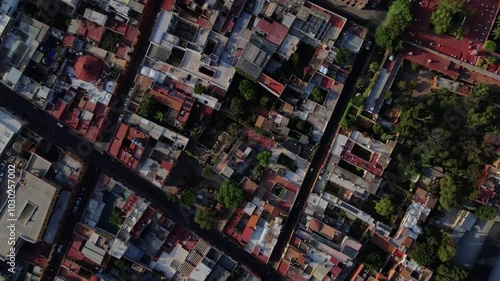 Wallpaper Mural Topdown aerial drone footage over the colorful streets of San Miguel de Allende, Guanajuato, Mexico at sunrise Torontodigital.ca