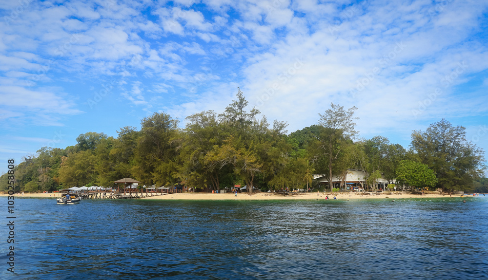 Explore the serene beaches and lush scenery of Mamutik Island in Malaysia on a sunny day Explore the serene beaches and lush scenery of Mamutik Island in Malaysia on a sunny day