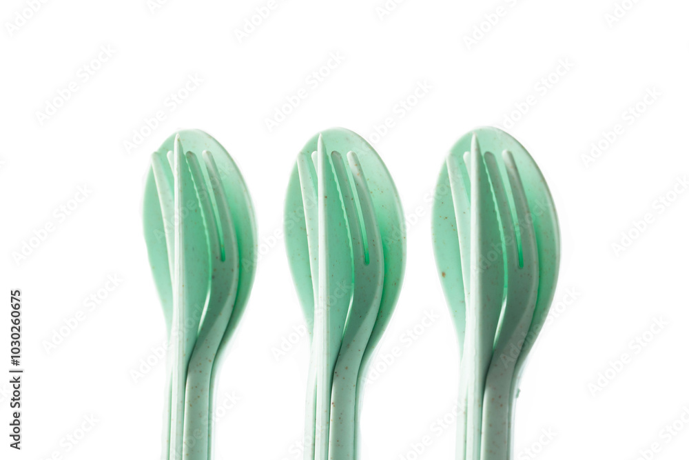 Compact set of cutlery on a white background, isolate, for trips and on the road, close-up Compact set of cutlery on a white background, isolate, for trips and on the road, close-up